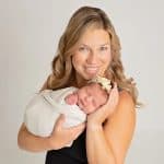 mother holding infant child